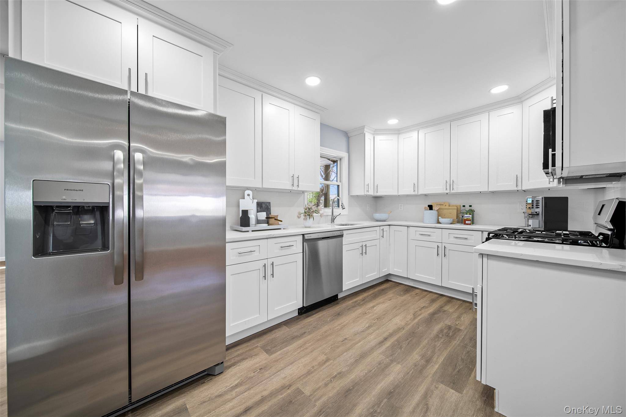 Beautifully renovated from top to bottom, this 4 bedroom, 2 bath Cape style home blends modern updates with a warm, inviting feel.