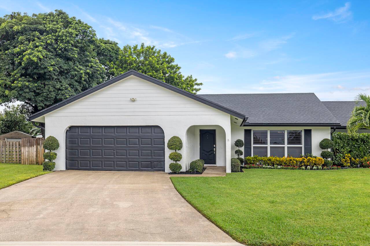 Beautifully updated 4 bedroom home with spacious, fenced yard and heated pool.
