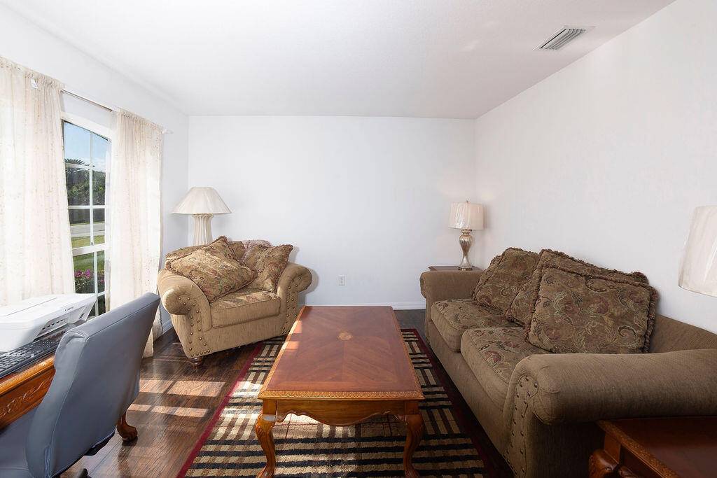Come take a look at this spacious corner lot home.