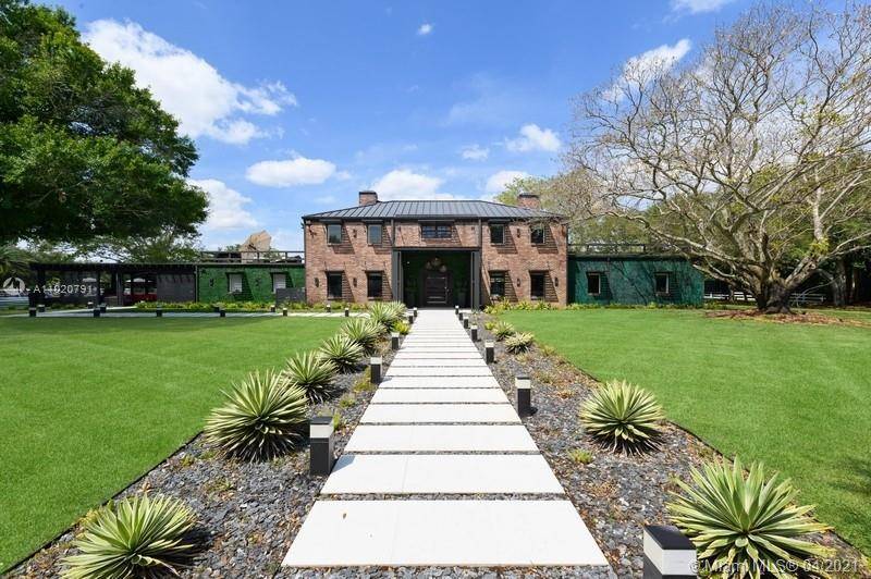 SELLER MOTIVATED ! An Equestrian Estate like no other in the prestigious area of Southwest Ranches.