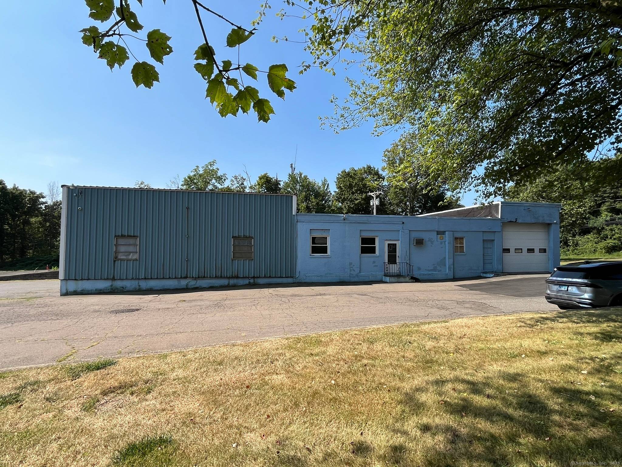 7, 350 sq. ft. industrial metal building, ideal for trucking operations with ample yard space and on site fuel tank.