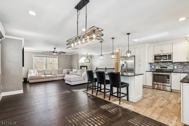 Set on beautiful manicured grounds in sought after Farmingdale, this refined residence offers close to 3, 000 sq ft of beautifully updated living space.