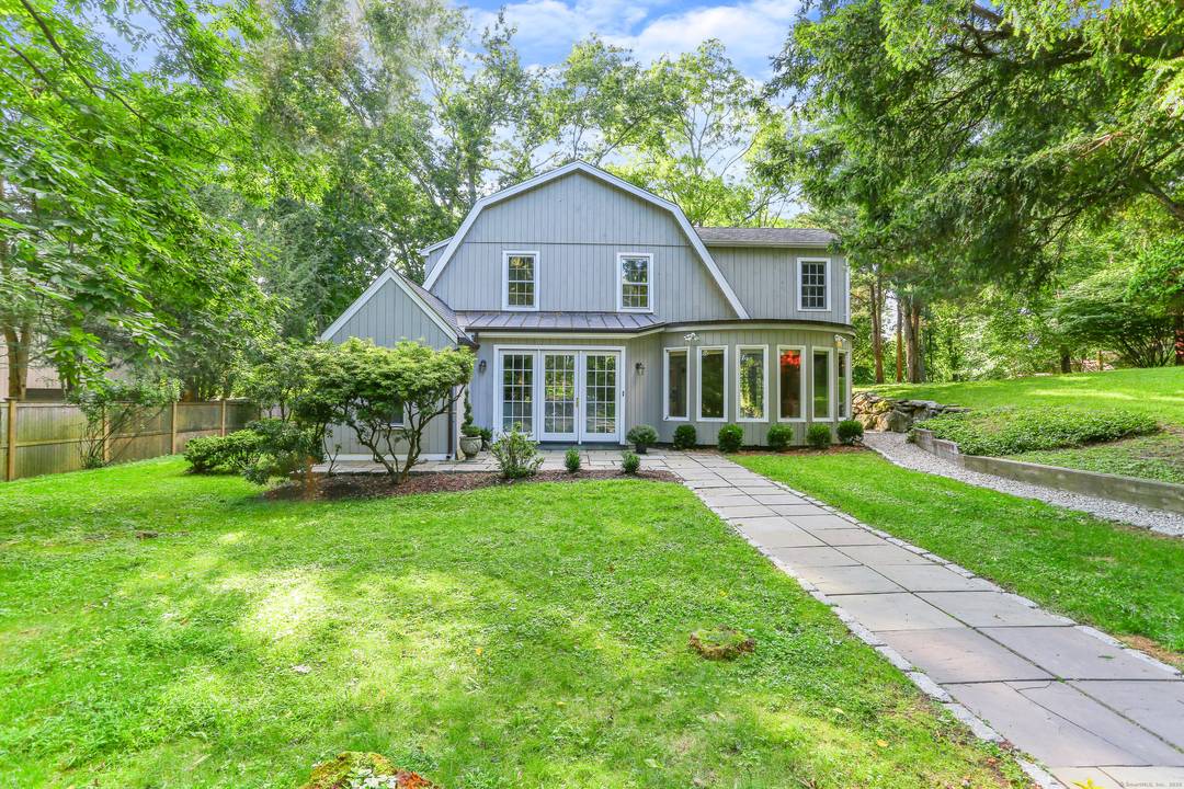 This delightful, sun filled home, nestled on beautiful park like grounds, offers the perfect blend of modern amenities and timeless charm.