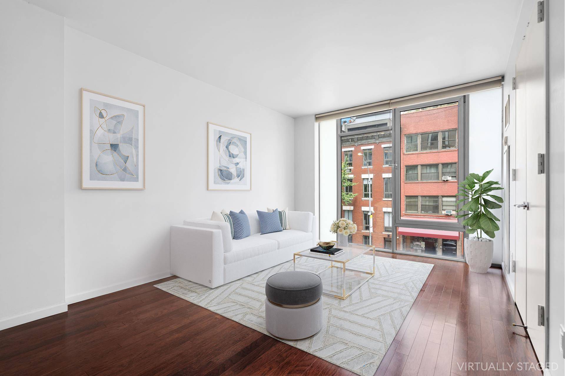 This home has a spacious kitchen with stainless steel appliances and marble countertops, large tiled bathroom with soaking tub, floor to ceiling windows, central air, private washer dryer, and a ...