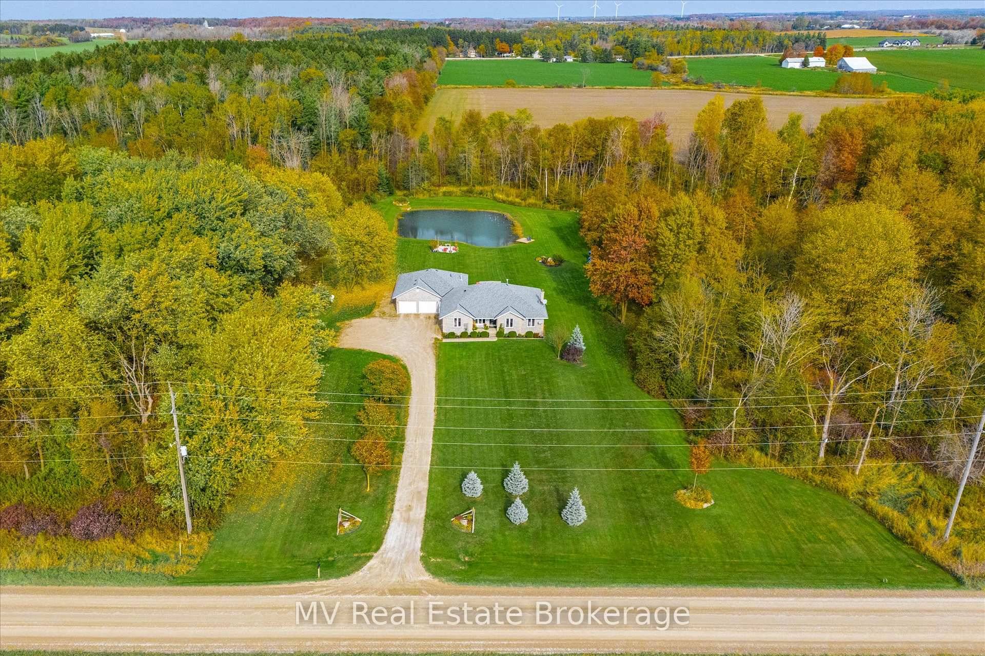 Nestled among trees, trails, and a spring fed pond, this stunning bungalow offers a peaceful escape just minutes from Fergus, Elora, and Guelph.