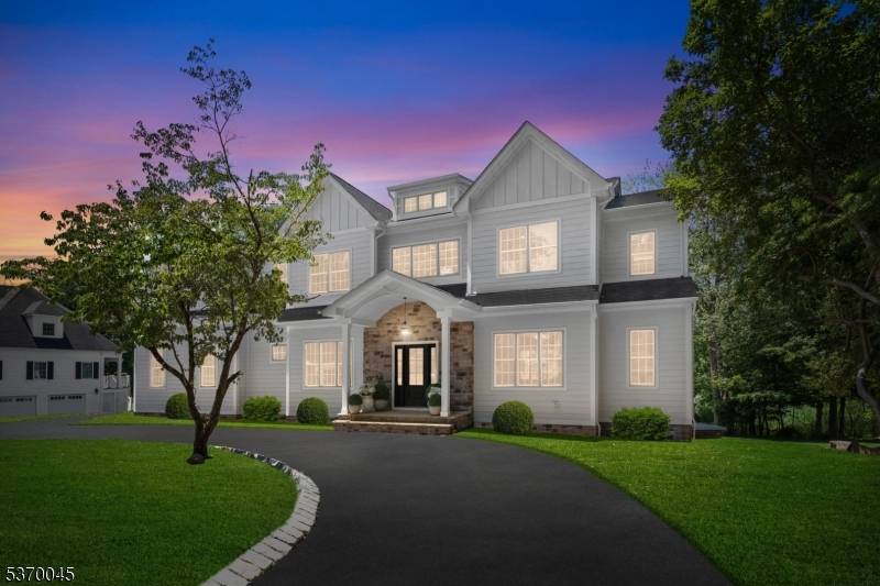 Nestled on a pristine two thirds of an acre lot in one of the town's most desirable Riker Hill section, this custom built new construction 6 bedroom, 5.