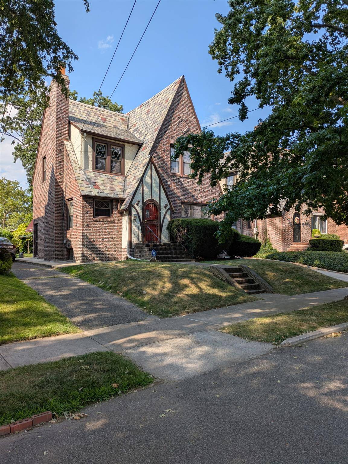 Welcome to 160 23 28th Avenue, a beautiful Tudor style residence nestled in the heart of Flushing, Queens.