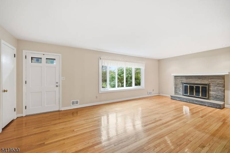 Welcome to this beautifully maintained three bedroom, two bath home nestled in one of Morris Plains' most sought after neighborhoods.