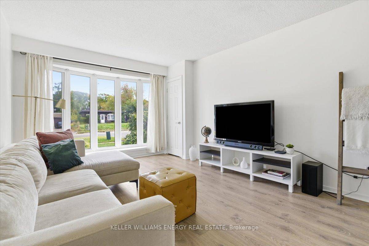 Step into this bright and cheerful main floor bungalow, filled with natural light and absolutely no carpet to fuss over.