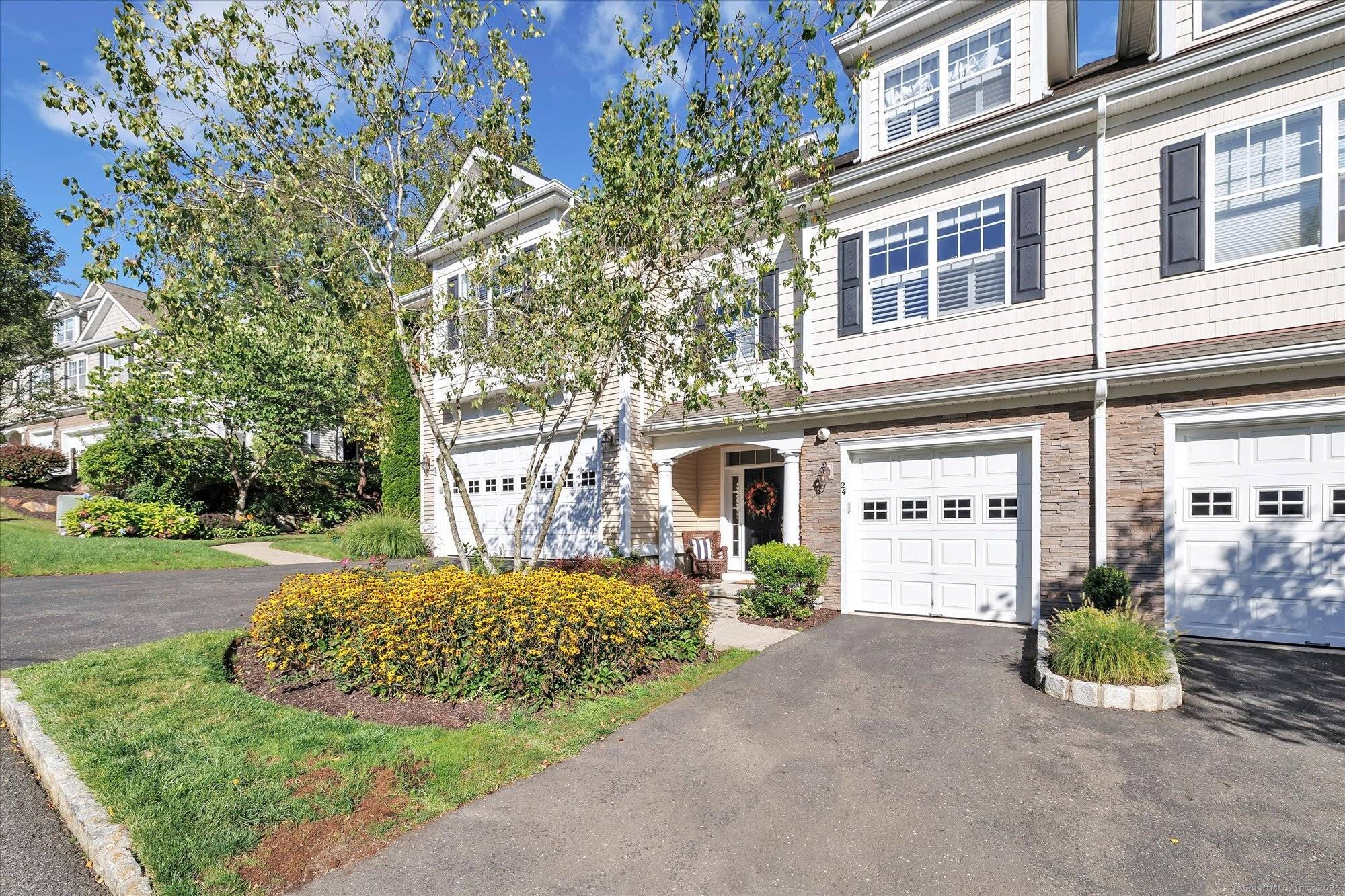 Truly spectacular remodeled Cummings style townhouse in the sought after Ridgewood at Middlebury community.