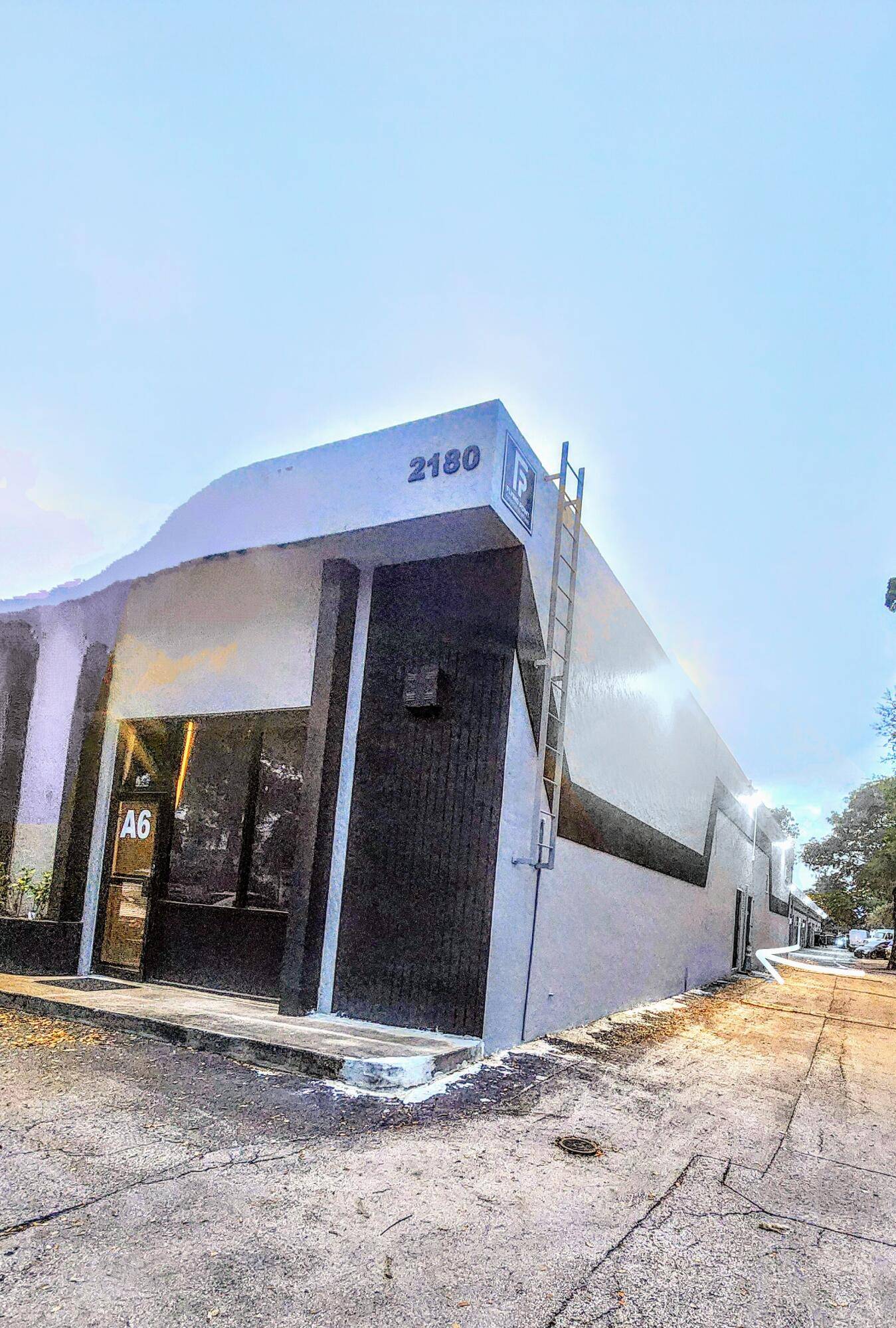 This two story loft style commercial space features an inviting open mezzanine and a front entryway, boasting 21 foot ceilings.