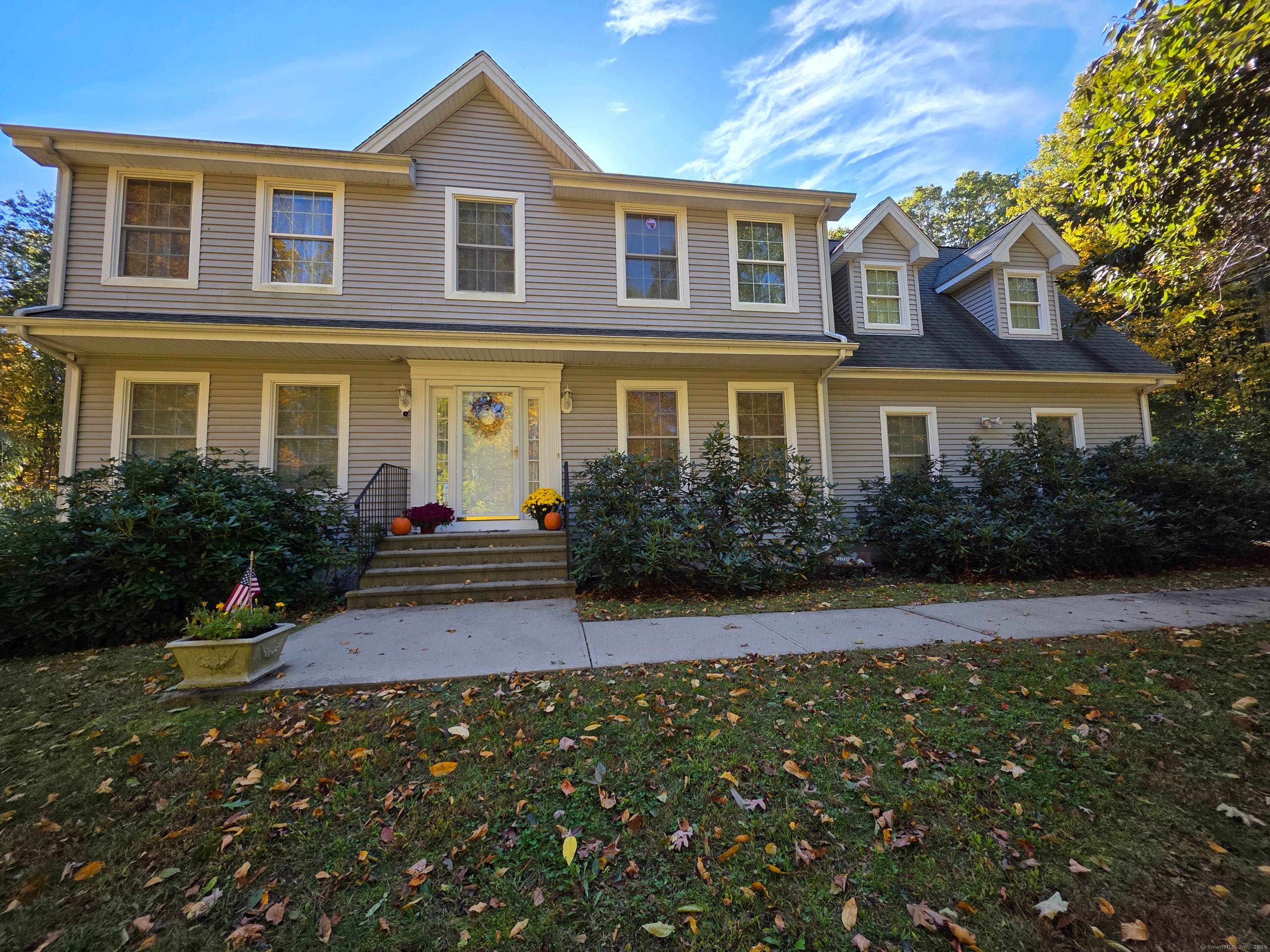 Enjoy this charming New England Colonial home, surrounded by rock walls on 2.