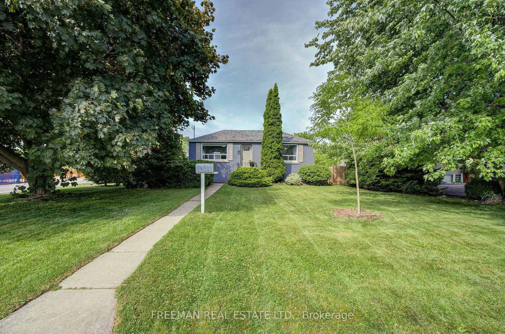 Surprisingly spacious and sunny southeast facing corner lot with a detached garage and double driveway, located just steps above Long Branch GO Station.