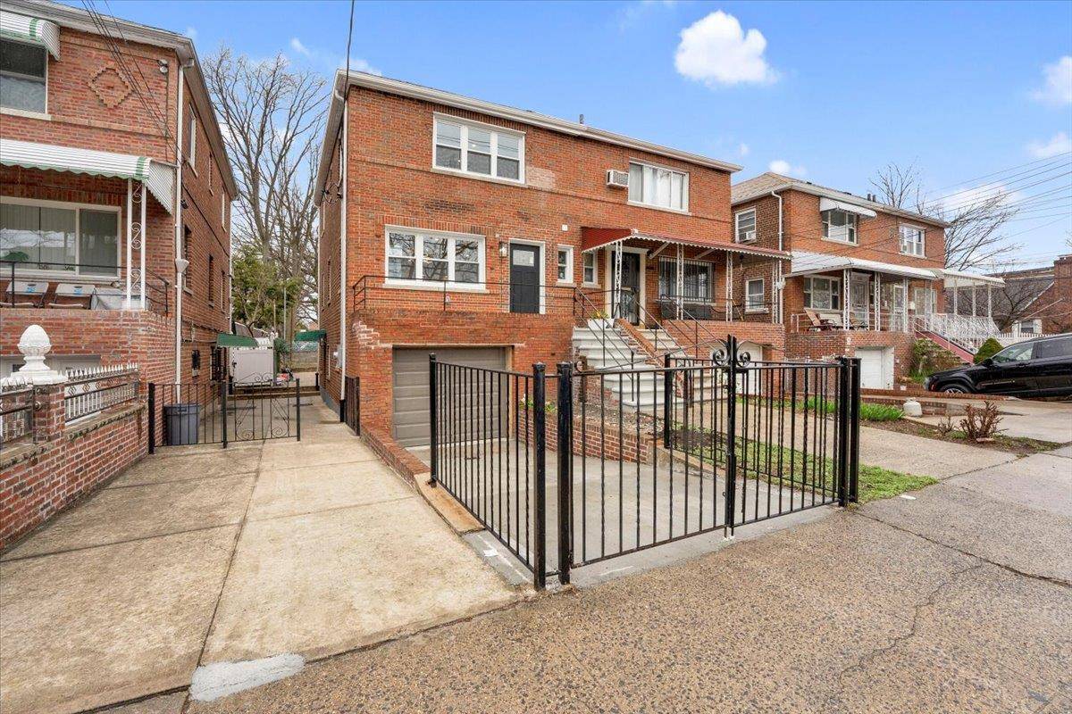 Single family stunning fully renovated semi attached brick home located in Pelham Gardens.