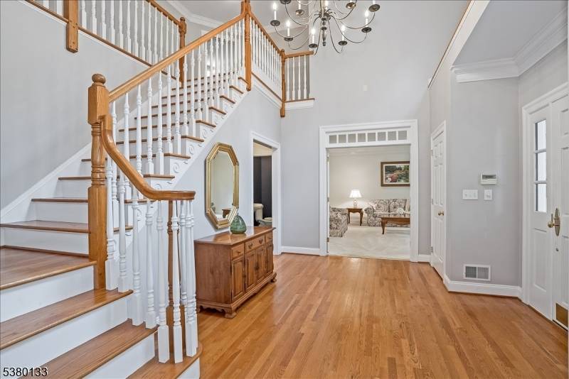 Privately sited on a quiet cul de sac, this striking stone and cedar residence, complemented by a three car garage, is gracefully set on 5 acres of manicured grounds surrounded ...