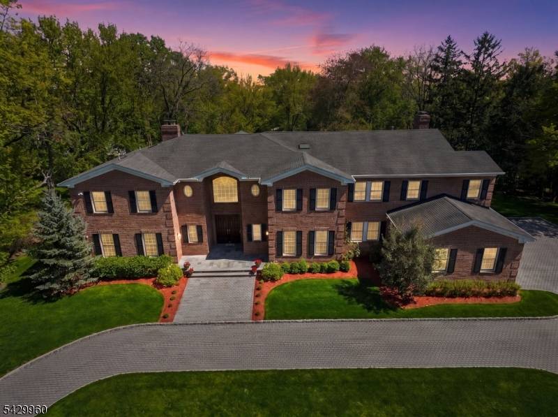 This spectacular 10, 322 sq ft ALL BRICK center hall Colonial features soaring ceilings, 10' 1st level, magazine worthy finishes a great open floor plan, ideally located on 0.