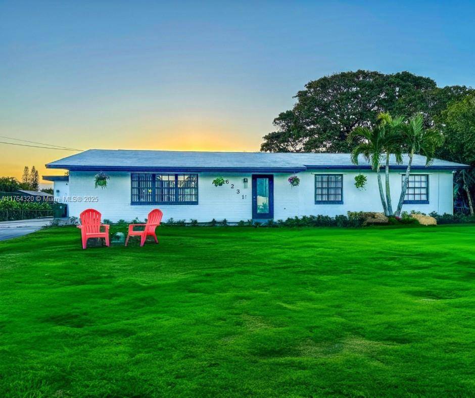 FULLY REMODELED ! Desirable SouthWest Ranches Home on close to 1 acre fronting a canal !