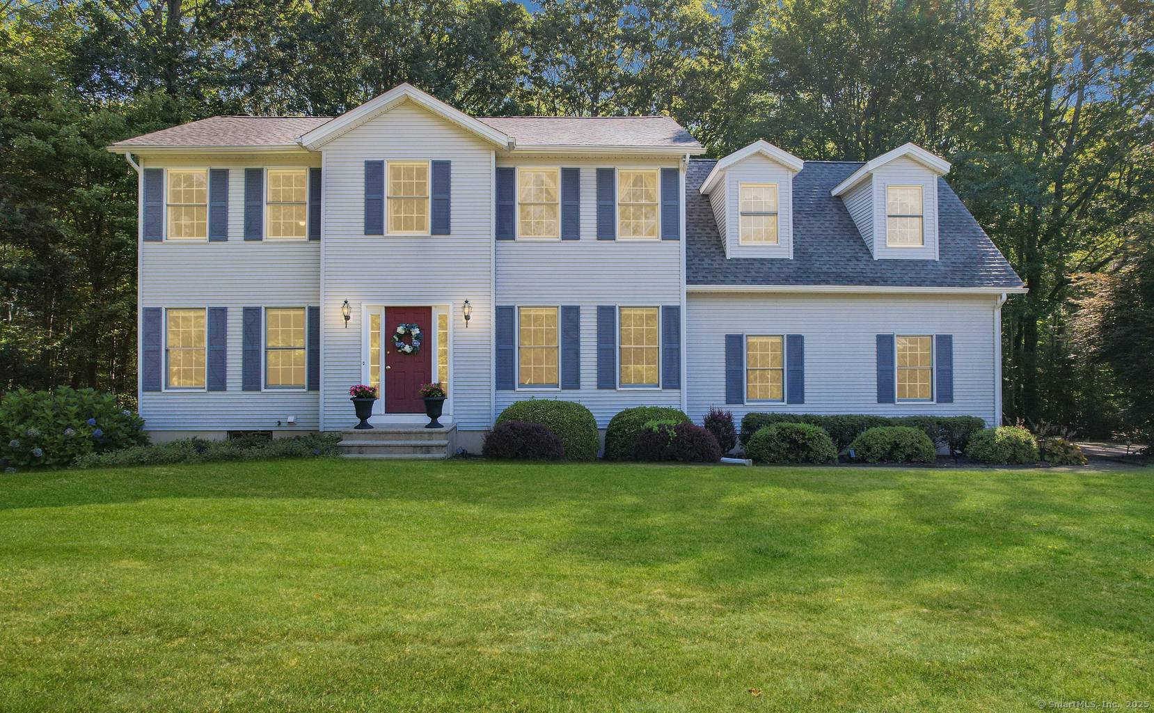 Situated on a generous 2 acre parcel on a quiet cul de sac street, this meticulously maintained Colonial exemplifies quality modern features.