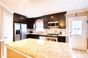 New price on this updated and spacious townhouse with three levels of living !