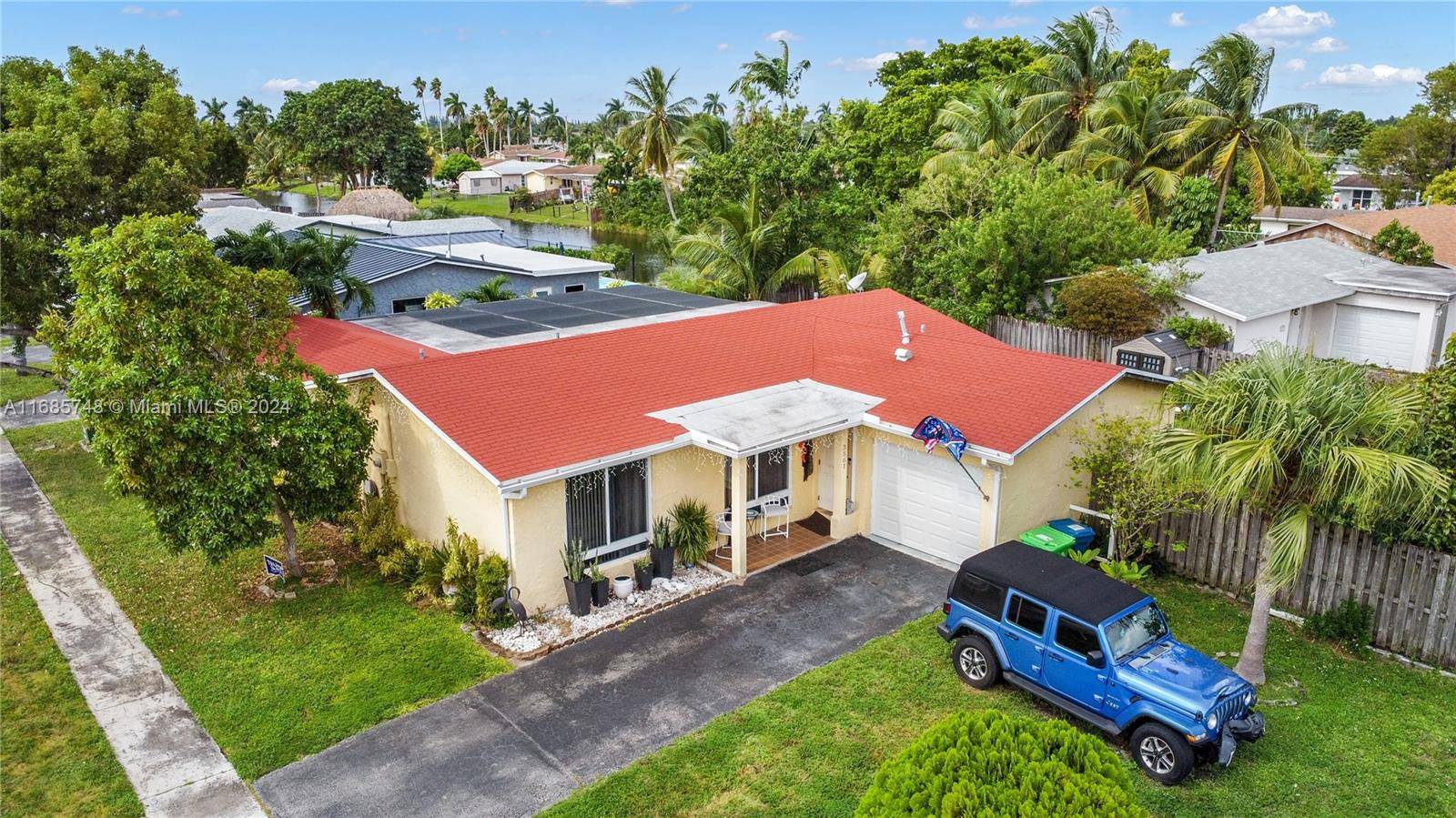 This charming 3 bedroom, 2 bathroom home offers a unique bonus with a converted garage, complete with AC, perfect for an extra room or office space.