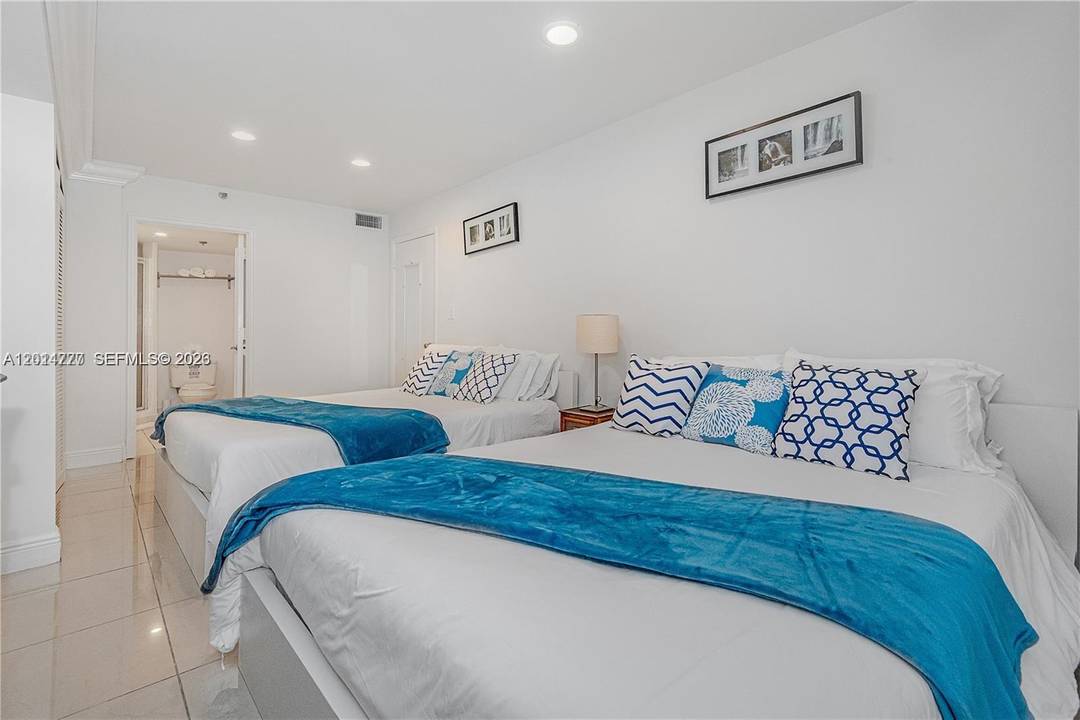 Enjoy living in the classic Alexander Condo with no rental restrictions and direct beachfront access !