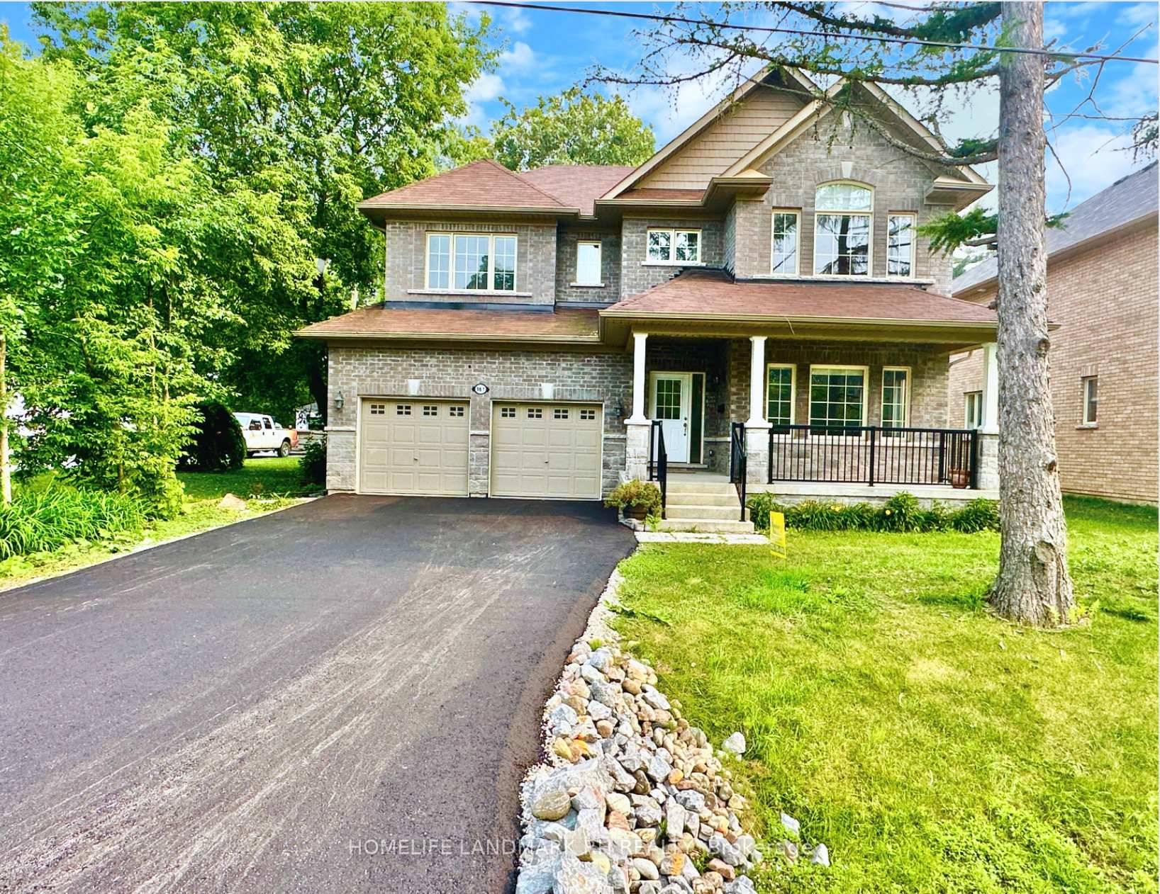 Bright and Spacious 4 Bedroom All Brick Double Car Garage Detached House w Huge south facing backyard !