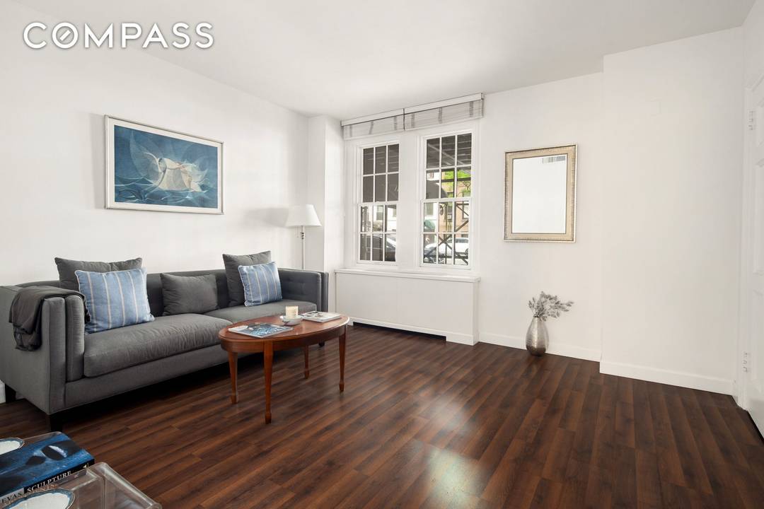 Lovely single story maisonette with a private entrance in a full service Upper East Side pre war cooperative.