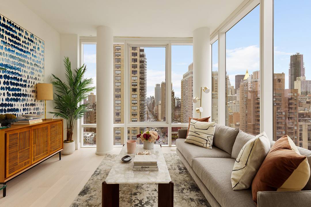 Luxury corner one bedroom home with 10' floor to ceiling windows, and expansive Southern and Manhattan Skyline views.