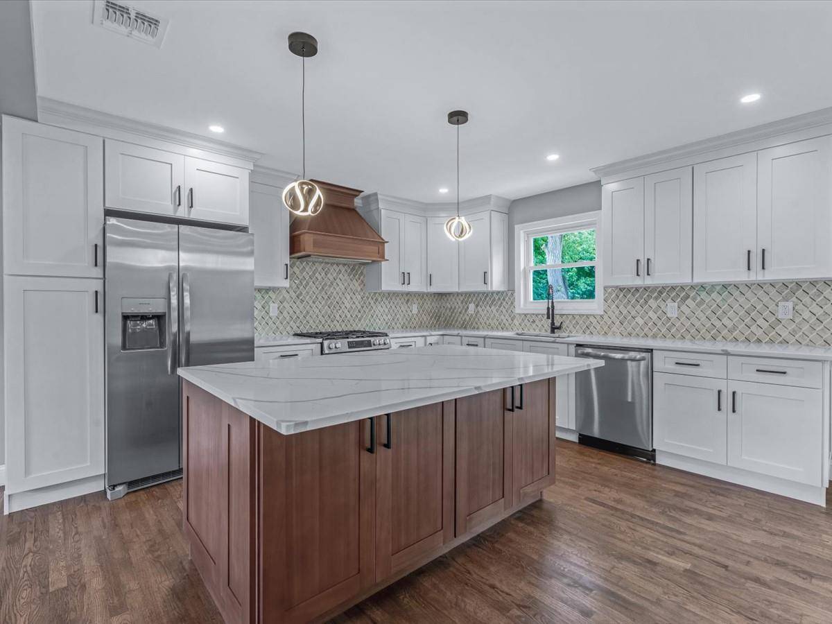 Elegant Center Hall Colonial in the Heart of Oakdale Welcome to this thoughtfully updated 5 bedroom, 3 bath center hall colonial, situated in the Connetquot School District.