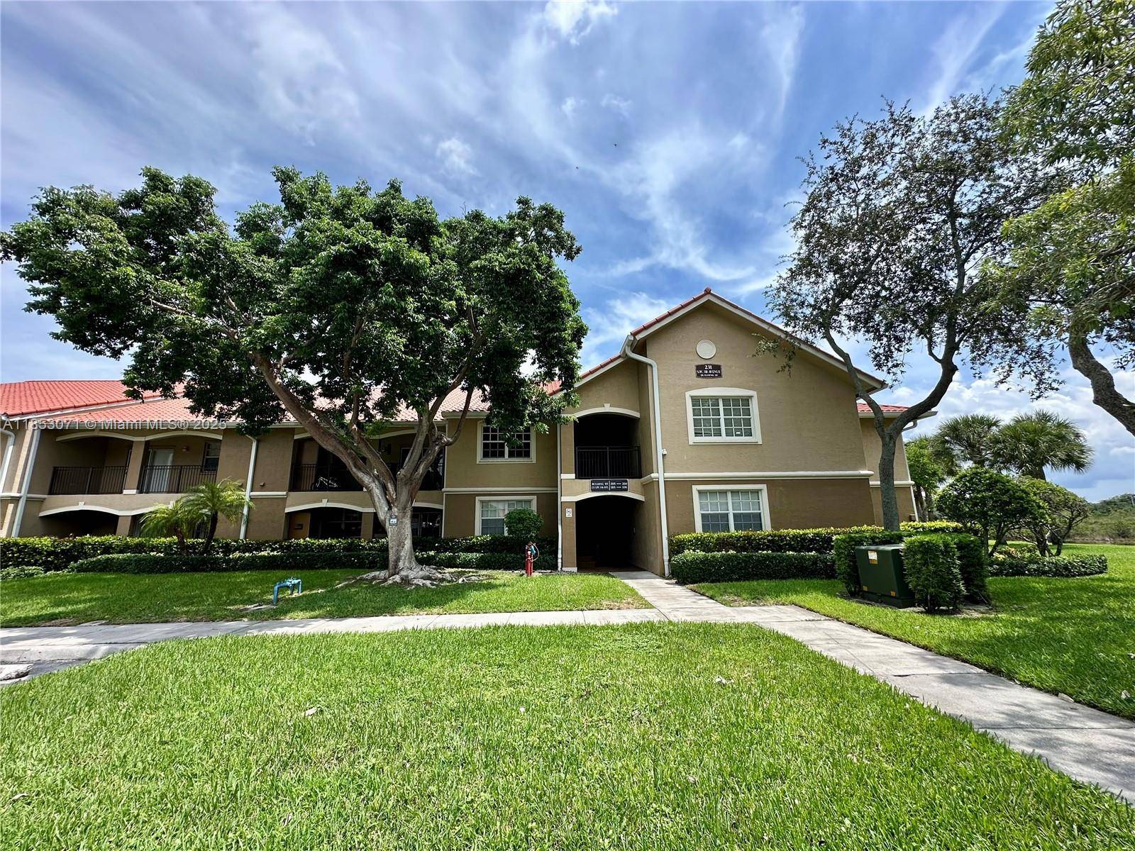 Enjoy relaxing water views of the canal from the spacious patio of this first floor 3 bed 2 bath condo in the gated community of The Marquesa, Pembroke Pines.