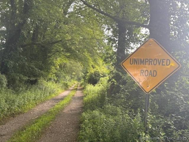 This unique 37 acre parcel offers a rare opportunity to own a large tract of raw land on a quiet, town dirt road perfect for those seeking privacy, natural beauty, ...