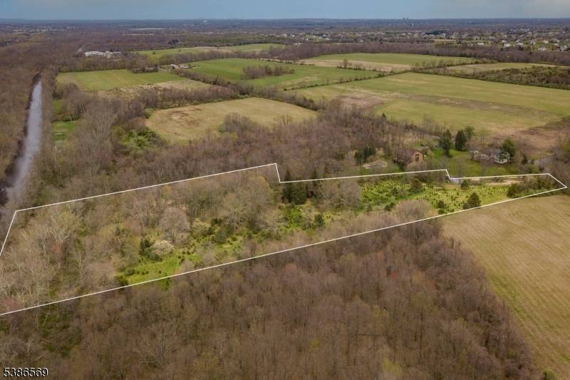 A rare opportunity to own a working Christmas tree farm on the border of the D R Canal surrounded by preserved land.