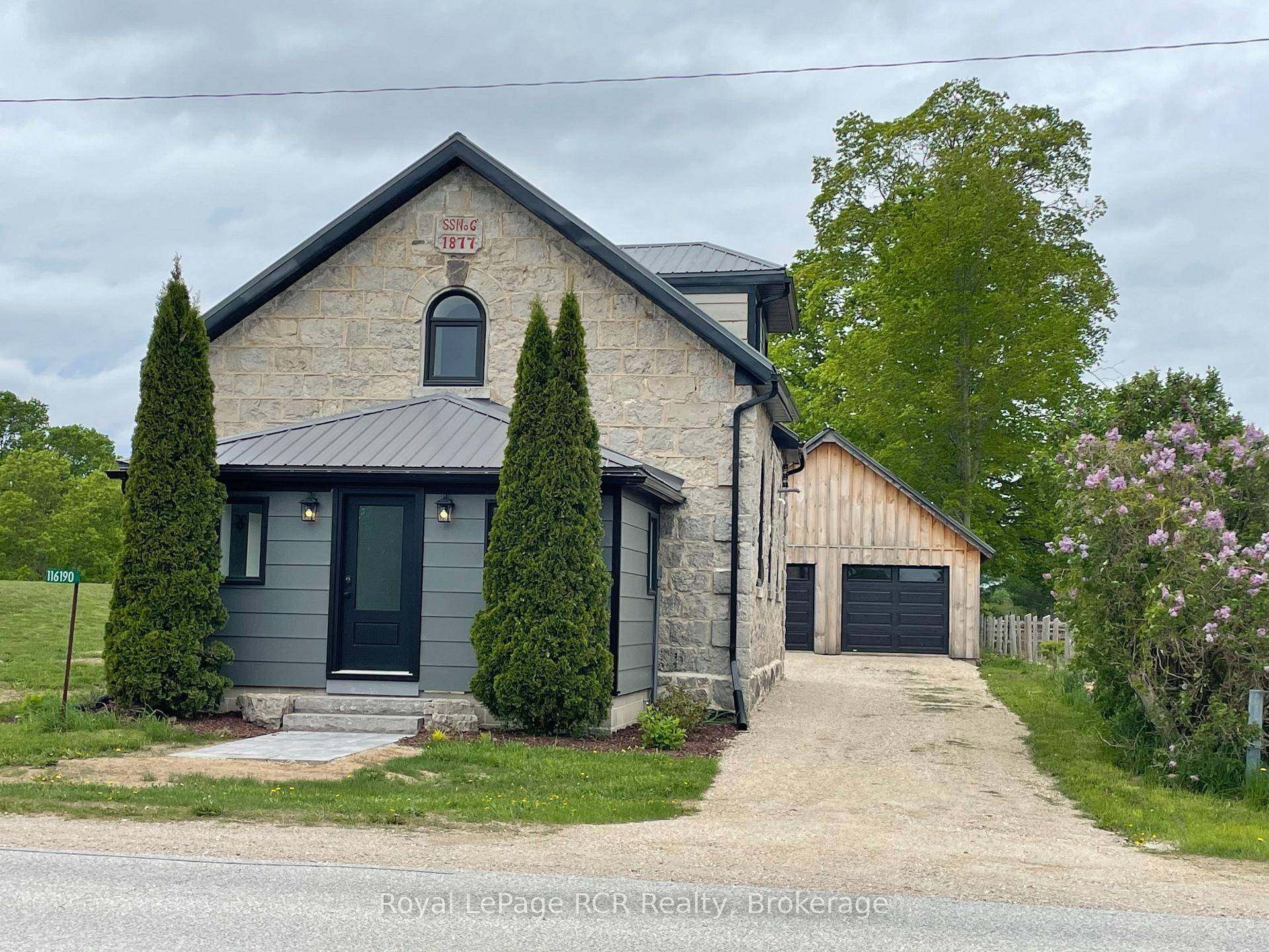 1877 converted Schoolhouse with detached double garage.