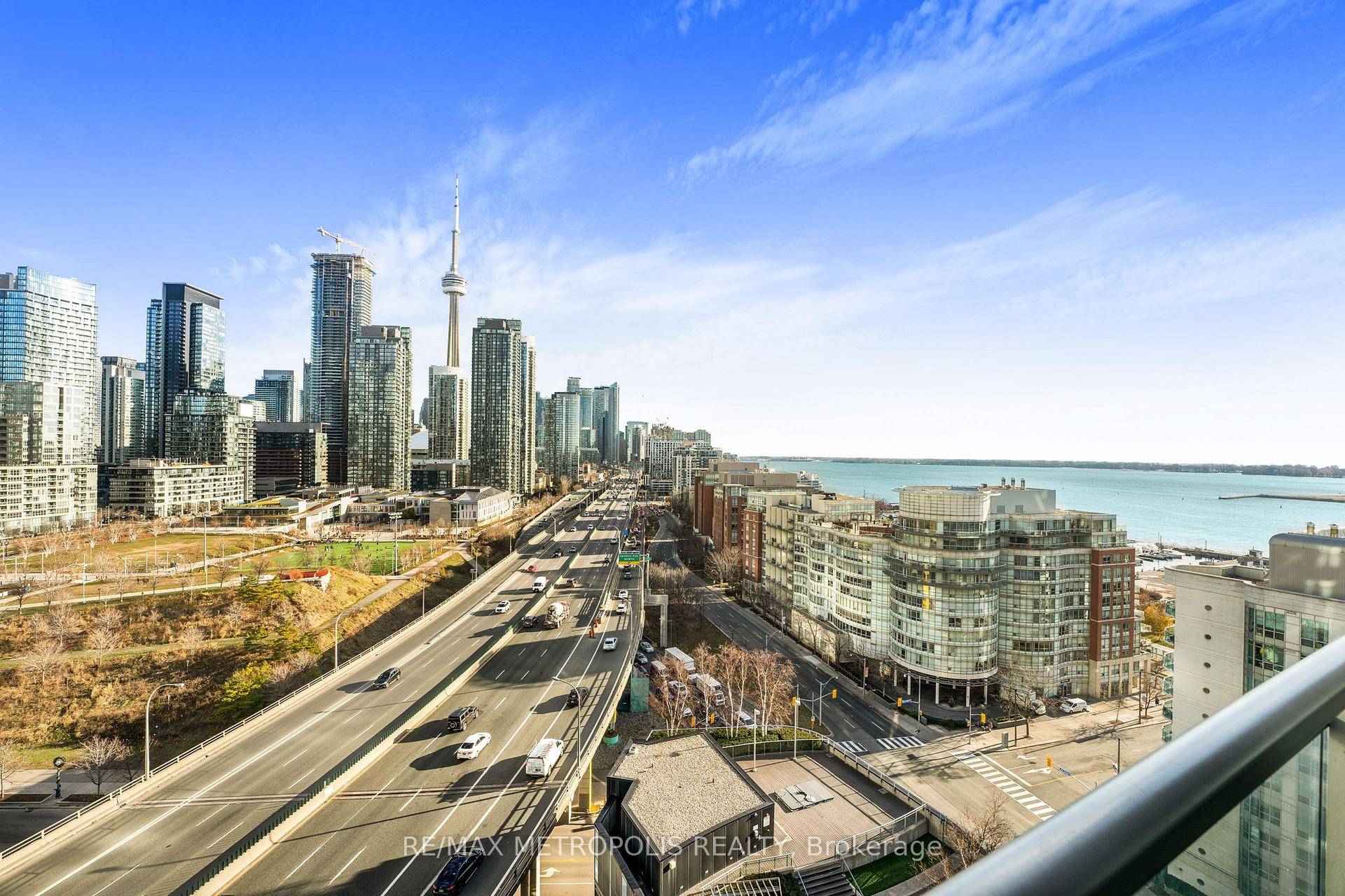 Welcome to this spectacular east facing 1 bedroom den condo at 38 Dan Leckie Way, offering breathtaking CN Tower, lake, and city views.