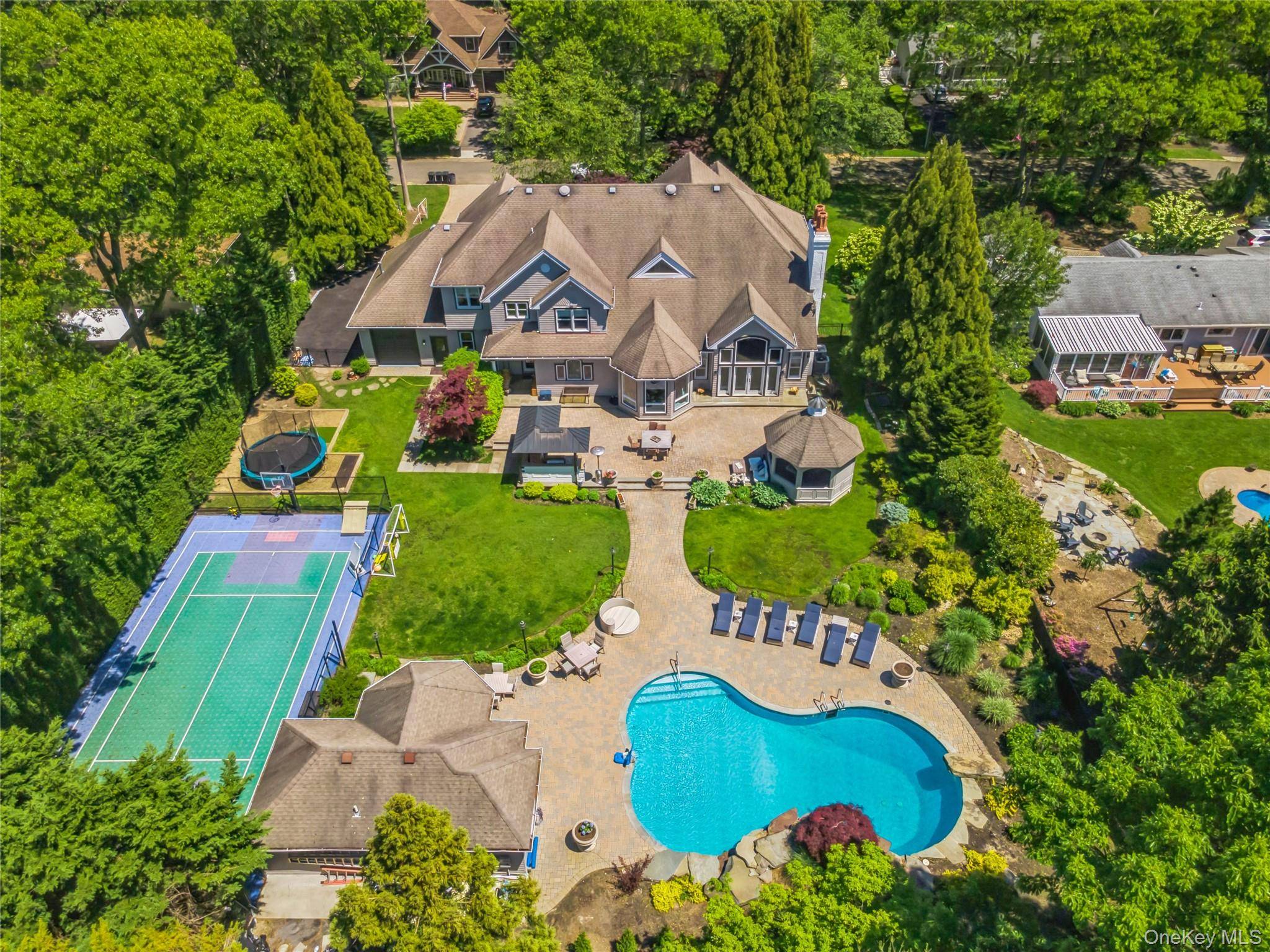 Welcome to a one of a kind, custom built luxury residence in the prestigious Smithtown Pines, nestled within the desirable Hauppauge School District.