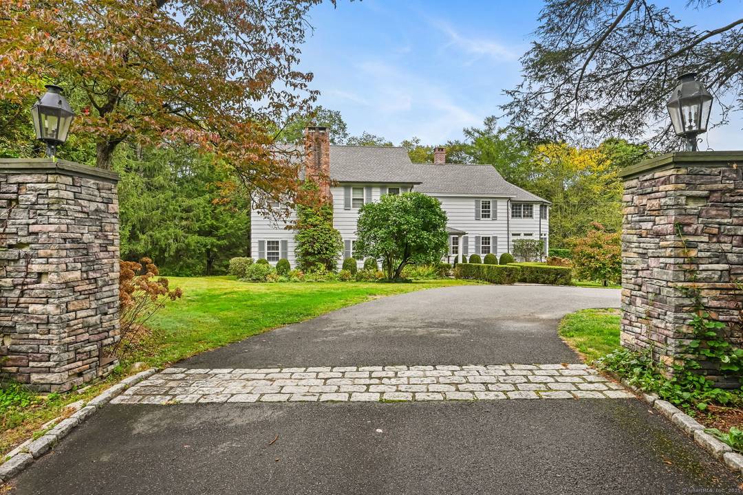 PRICED TO MOVE. Set along one of Fairfield County's most picturesque and prestigious roads, this vintage Wilton estate offers a rare blend of historic character and modern potential.