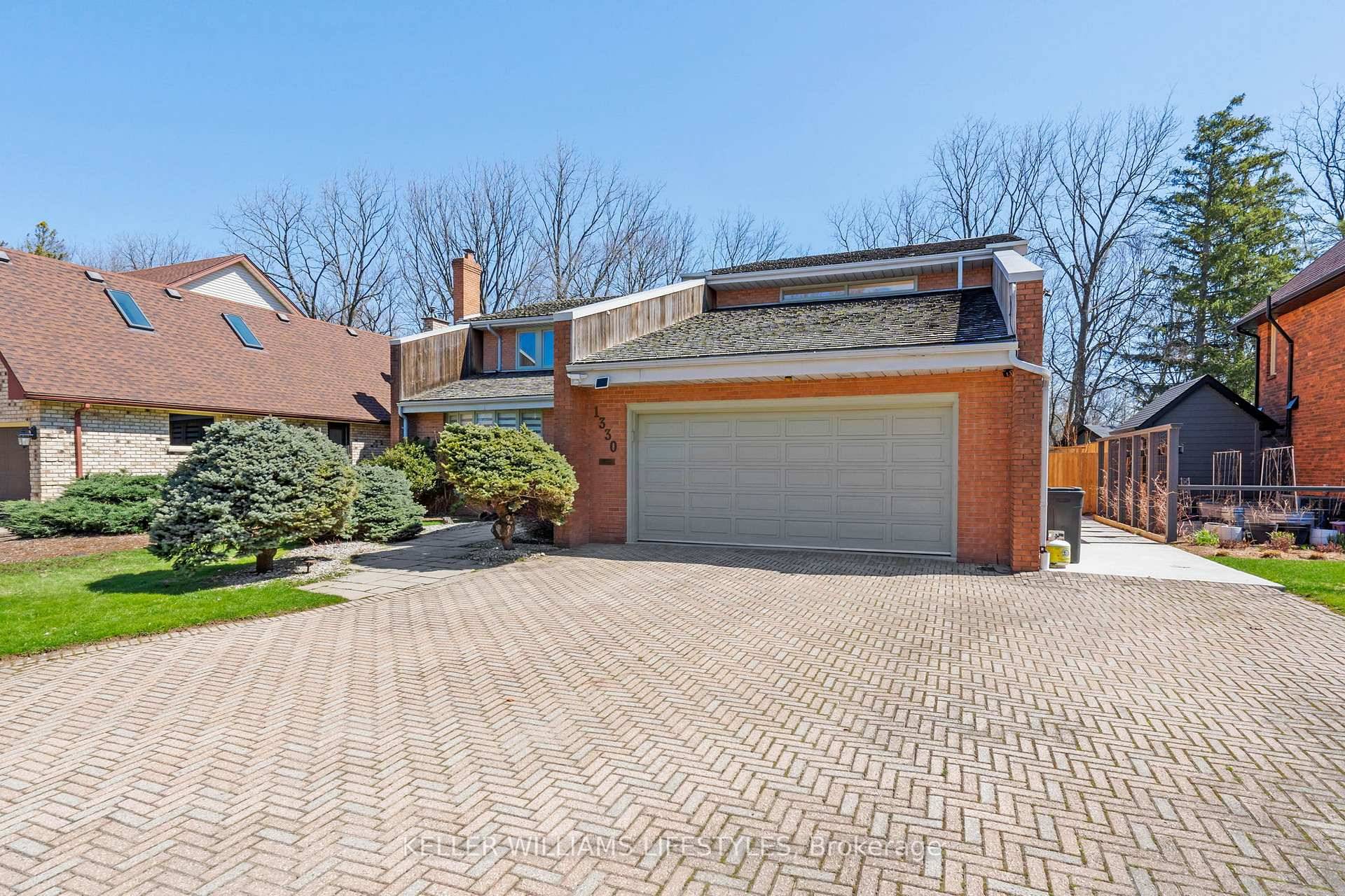 Step into refined living at 1330 Sprucedale Avenue, an architect designed executive home in North London's prestigious Stoney Creek Meadows.