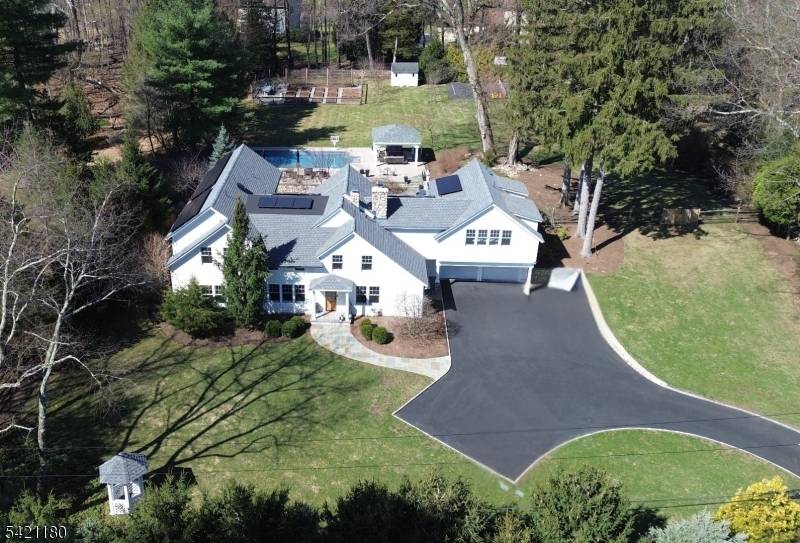 Originally built in 1826 and masterfully expanded and renovated, this exceptional Ramsey estate blends timeless character with sought after amenities on 1.