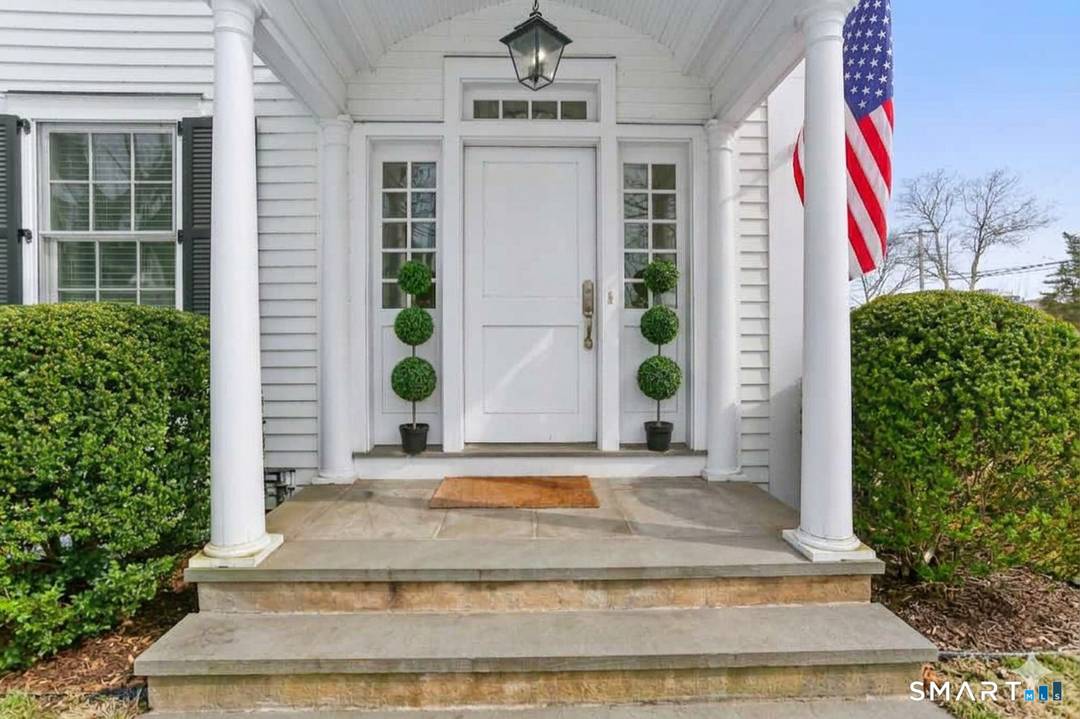 Enjoy stylish and easy living in this spectacular townhome on Southport's storybook Spruce Street.