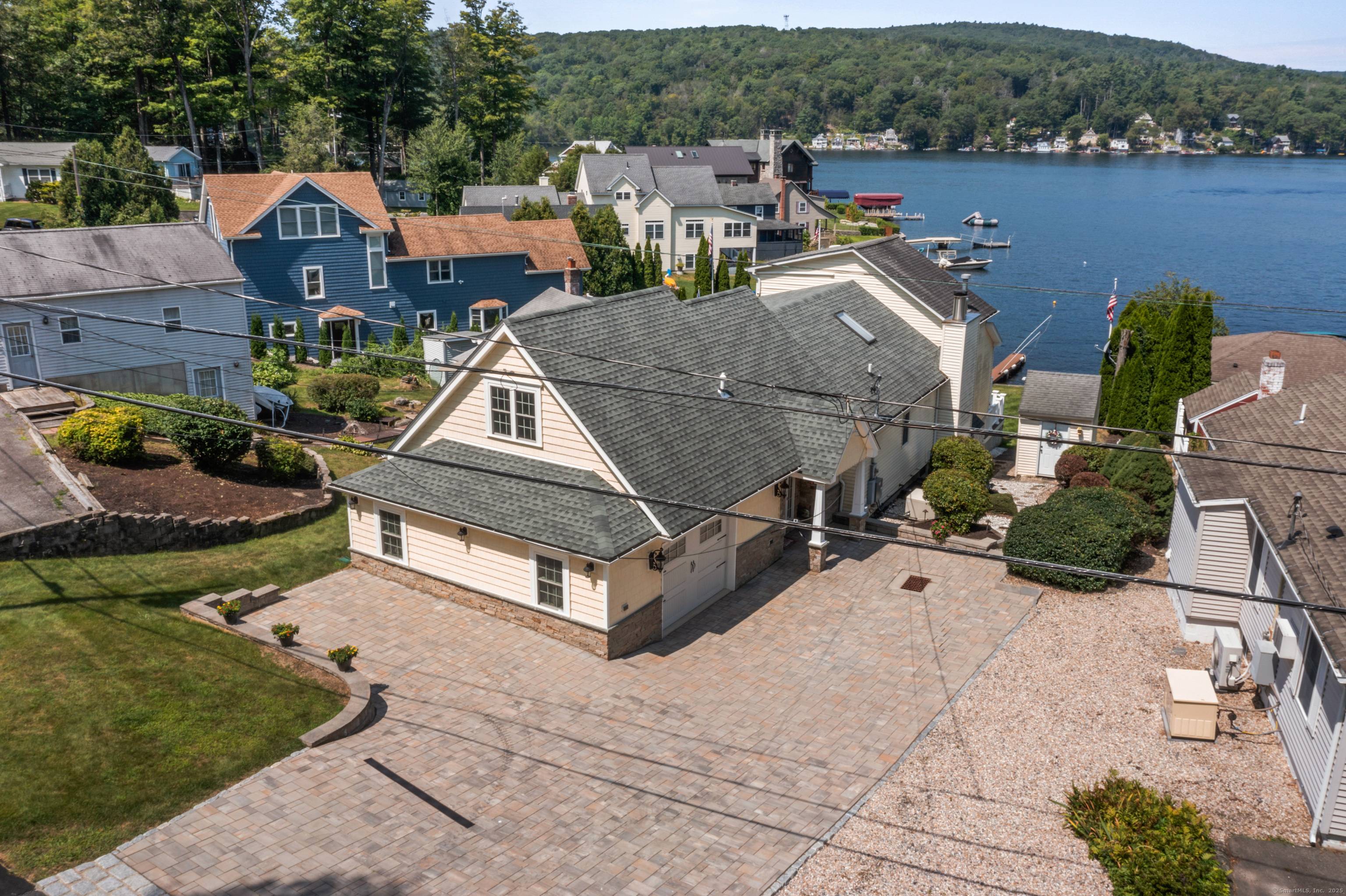 Experience premier waterfront living on Highland Lake in this beautifully maintained 3 bedroom, 3 bath home offering stunning panoramic lake views and direct water access.