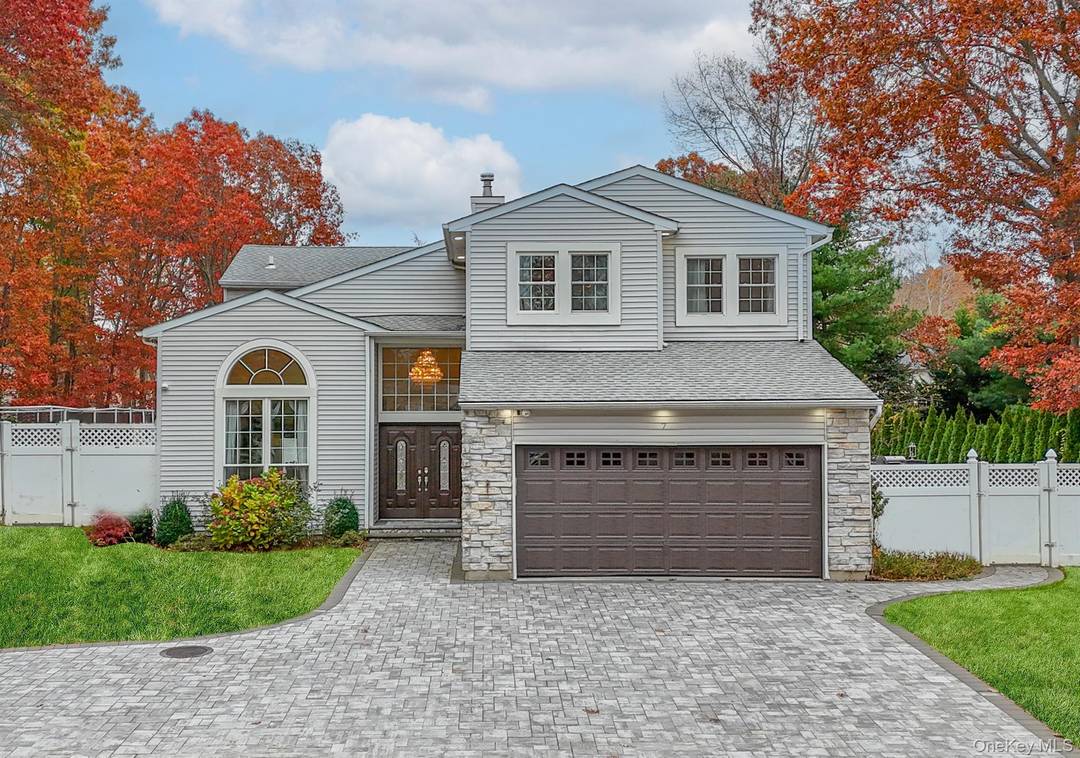 Welcome home to this grand 5 bedroom, 3 bathroom residence in Lake Grove, a part of the Three Village School District.