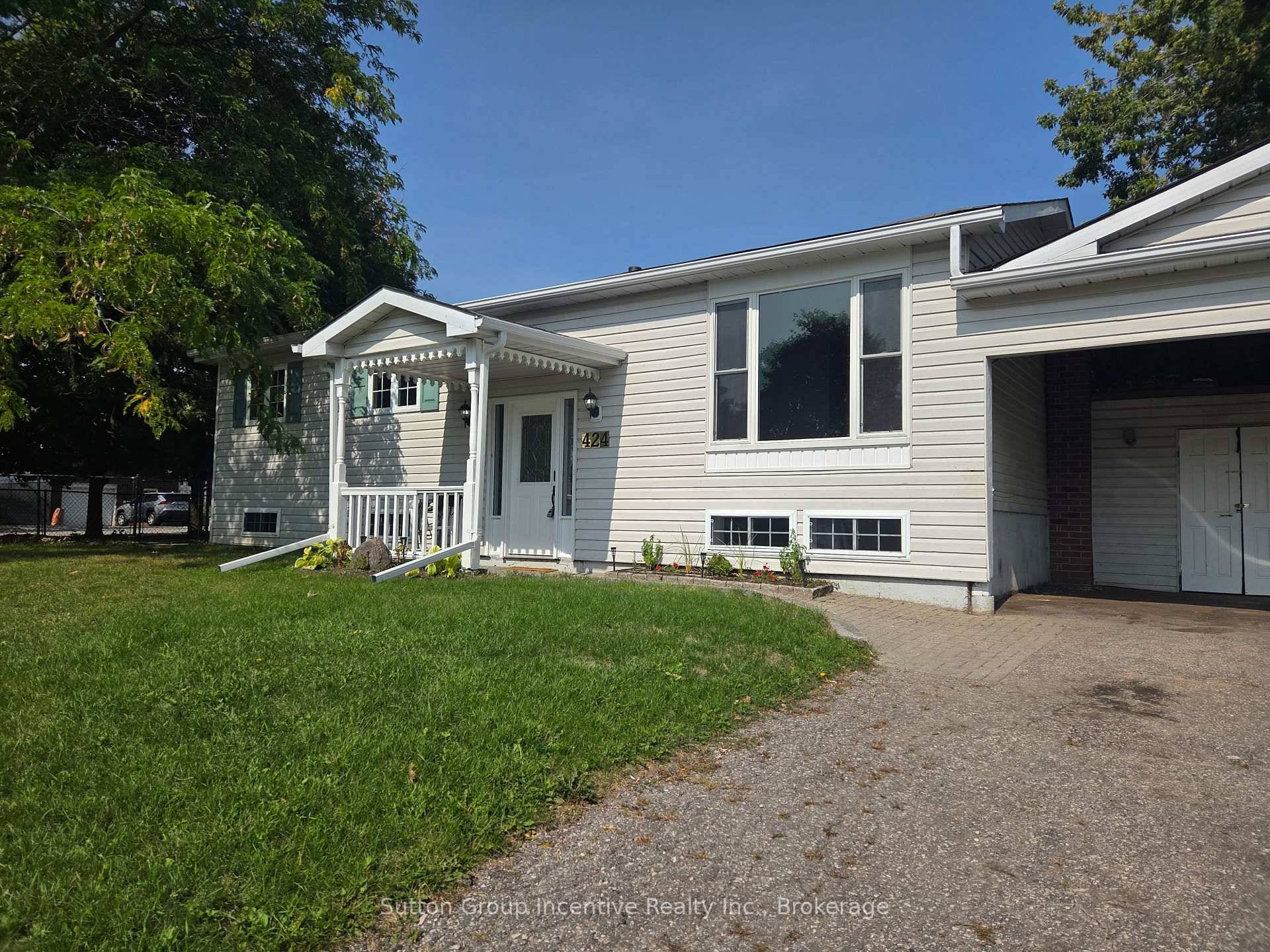 This easy to maintain split level home has been professionally painted throughout and outfitted with new flooring, carpeting, baseboards, vanities, lighting, bathroom fixtures, and a new laundry sink.