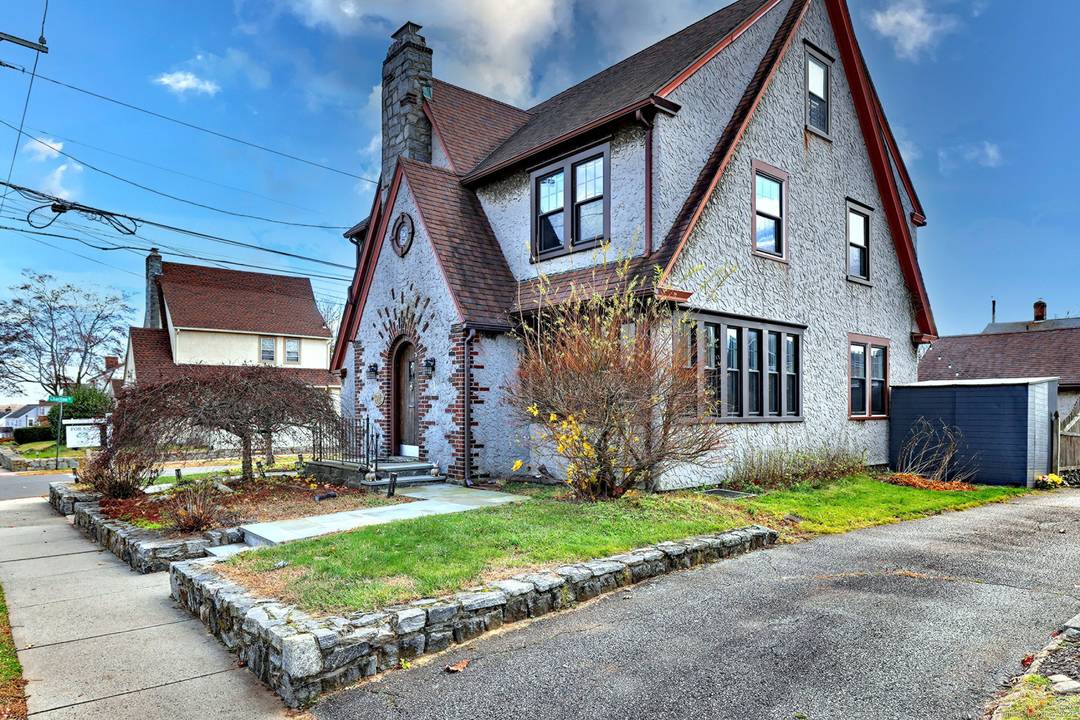 Charming Tudor style home on a desirable corner lot !
