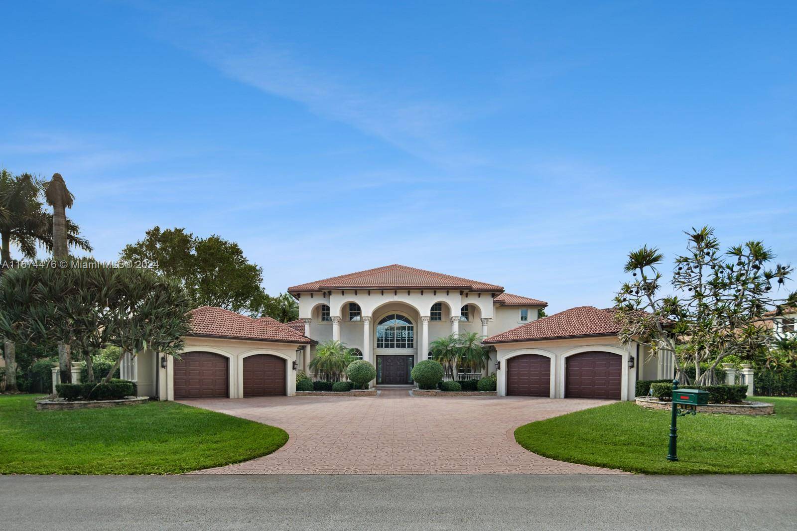 Stunning Custom Wellington model waterfront home in the prestigious, gated Stonebrook Estates community in Davie, Florida.