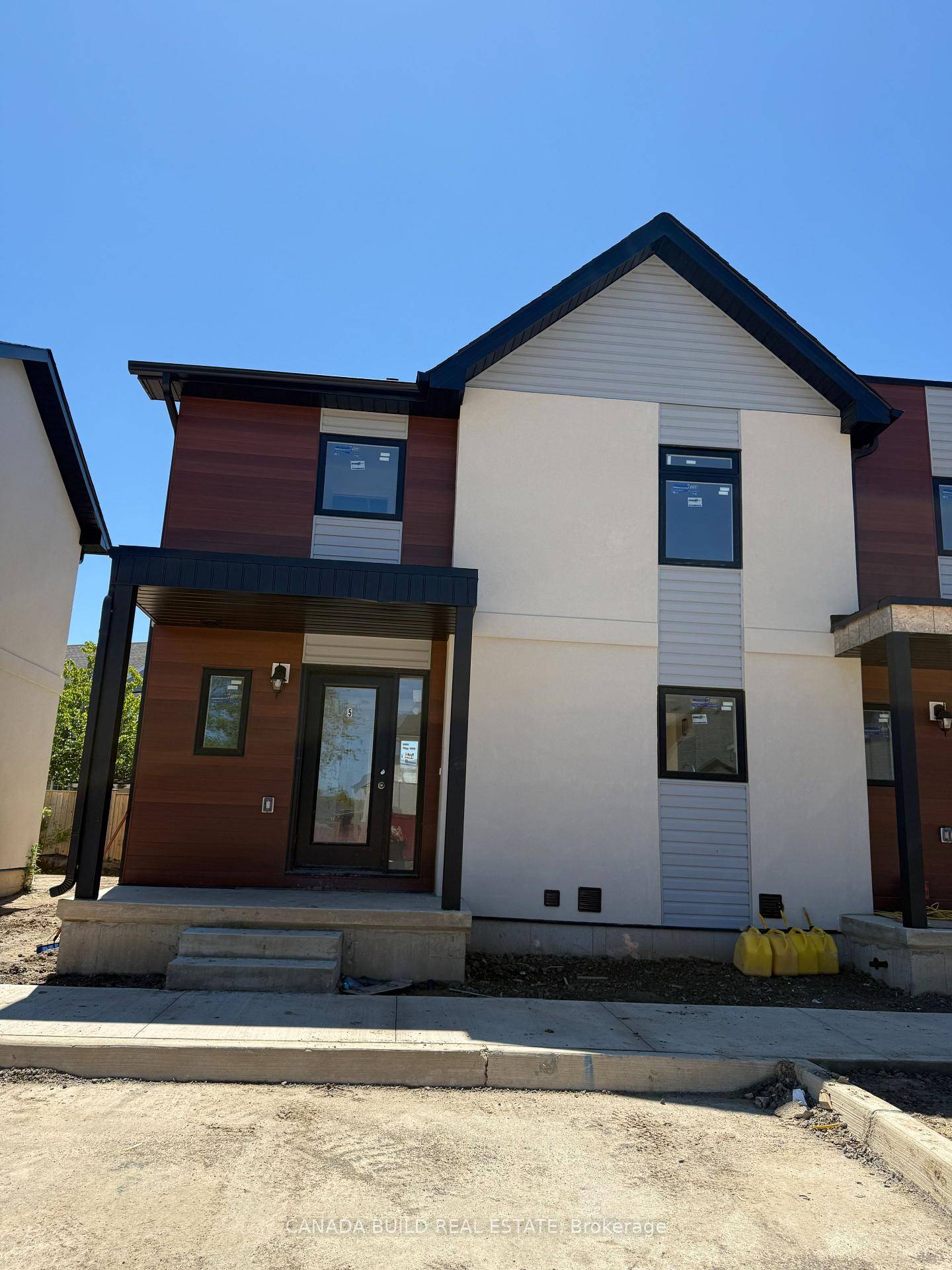 Exquisite new build 2 storey townhome with finished basement offering a contemporary living experience with sleek design amp ; an optimal location.