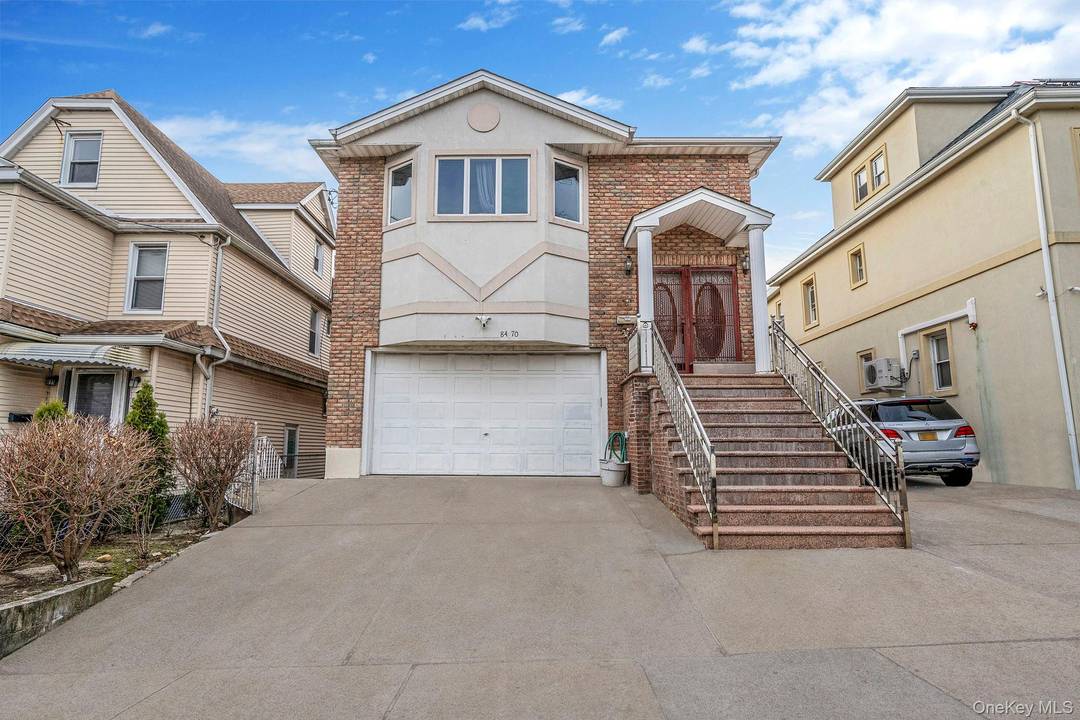 Stunning Updated 8 Bedroom Brick Duplex With Finished Basement Apartment.