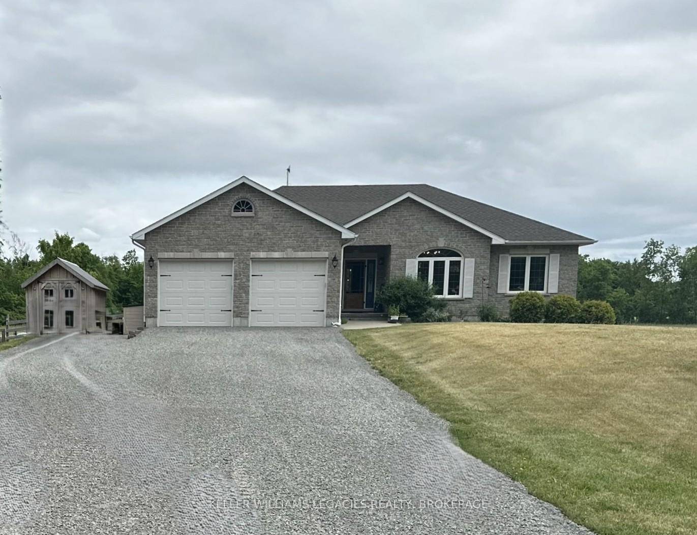 Welcome to this beautifully maintained country life turn key bungalow, perfectly set on a quiet country road just 14 minutes north of the 401.