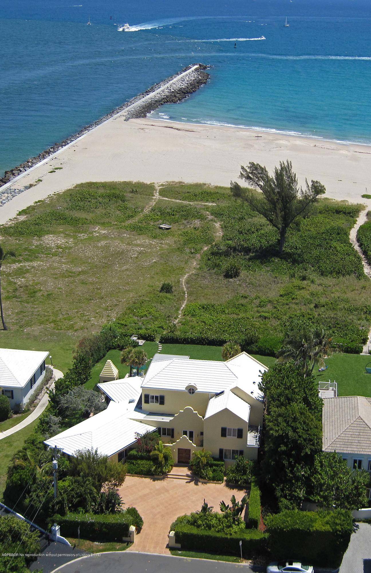 Direct oceanfront home at the north end of Palm Beach Island.