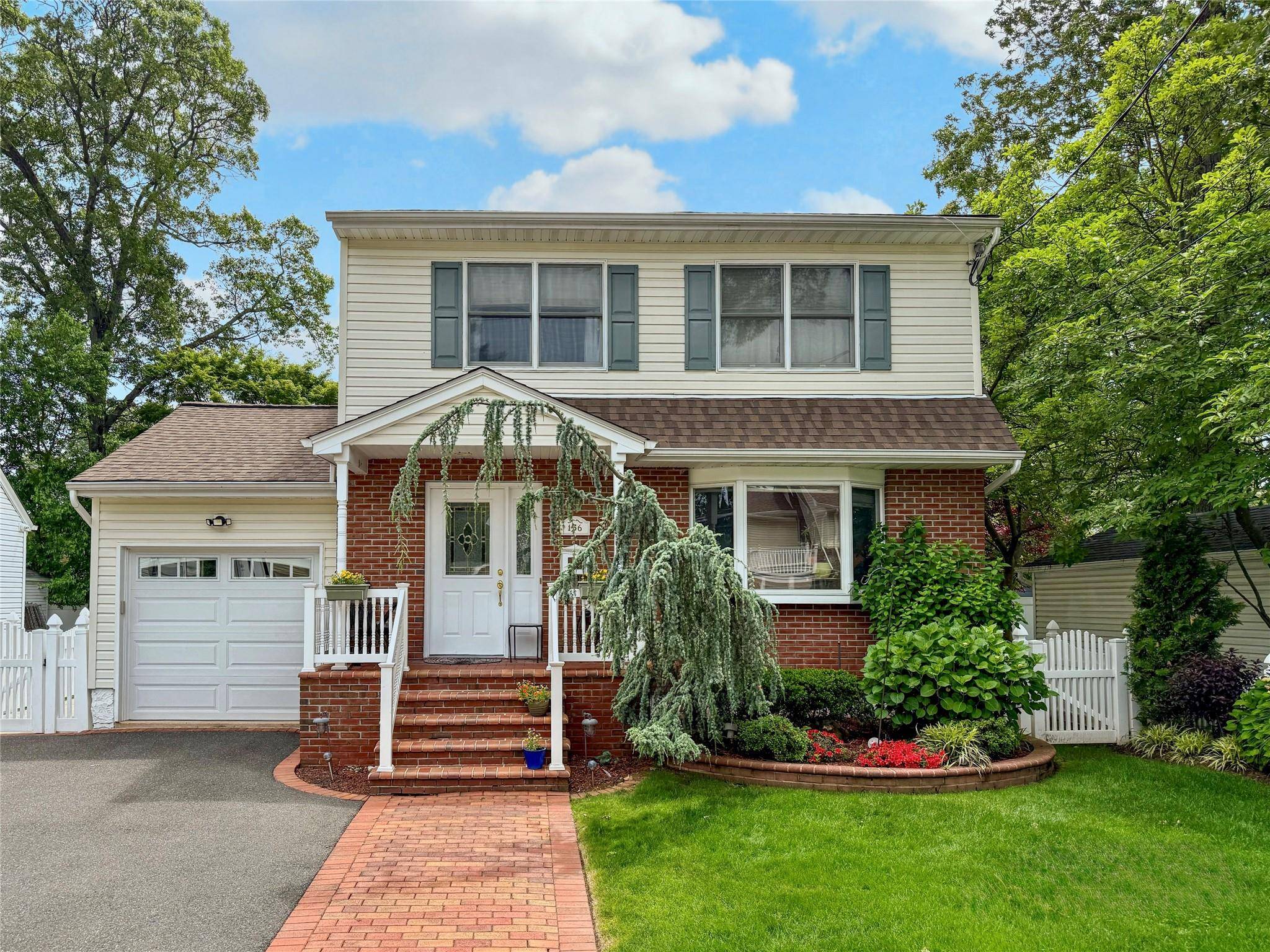 This young contemporary colonial family home, situated in the heart of Valley Stream, boasts four spacious bedrooms and two and a half bathrooms, blending modern updates with classic elegance.