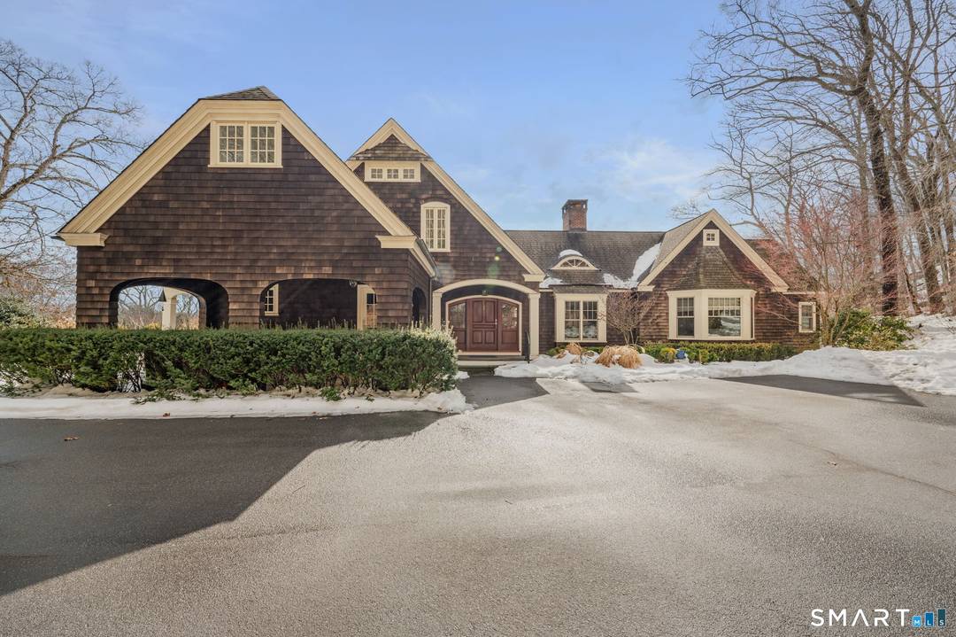 Amazing custom built Nantucket style Cape situated on sprawling grounds, terraced high above a picturesque great yard overseen by natural highlands.